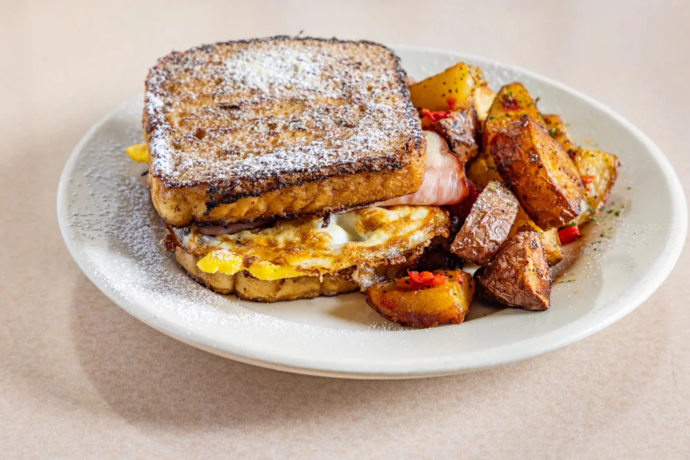 Monte Cristo sandwich with roasted home potatoes
