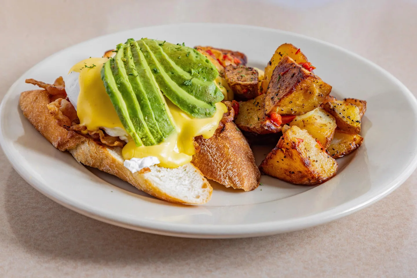 California eggs Benedict with avocado and roasted home potatoes